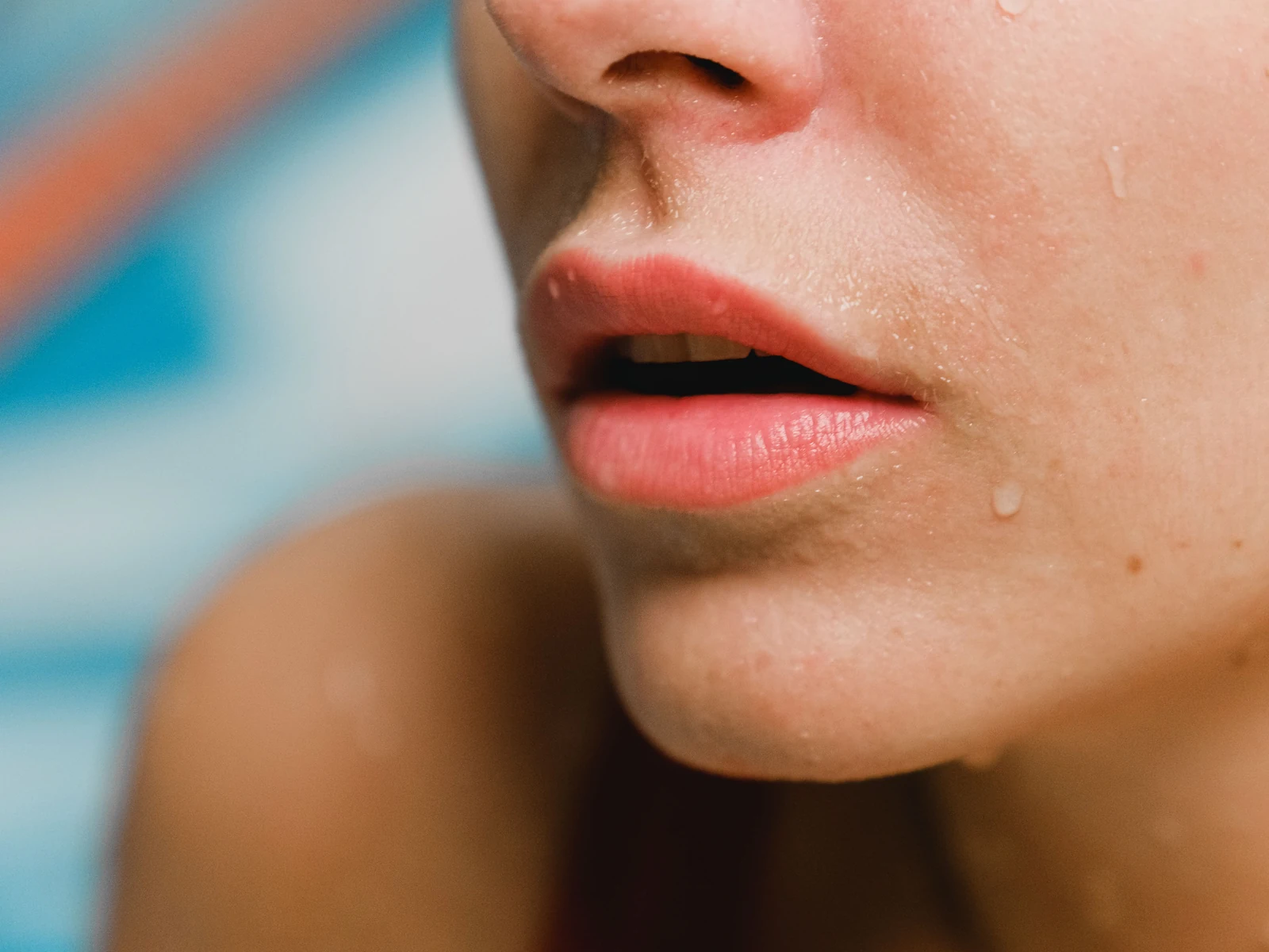 Close-up of relaxed lips and natural skin texture.