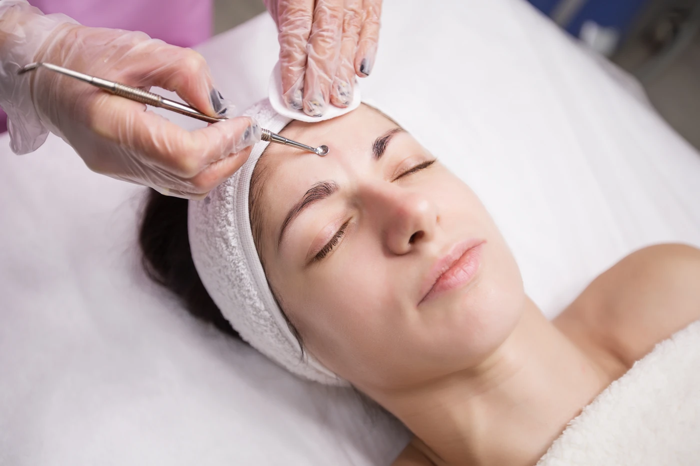 Close-up of careful facial cleansing at BE SPACE.