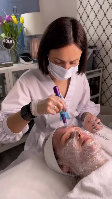 Yuliia performing a facial microneedling treatment at BE SPACE.